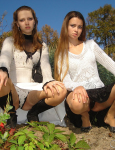 Young girlfriends outdoor in the park in body stockings